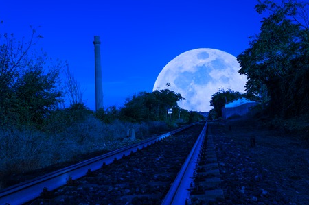 country railway at night to the super moonの写真素材