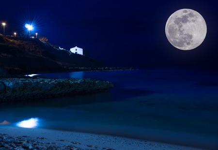 Night seascape with tiny churchの写真素材