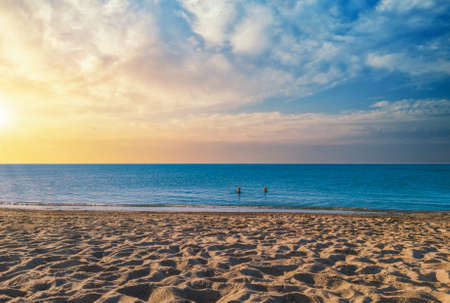 landscape of beach at sunset with dramatic cloudy skyの写真素材