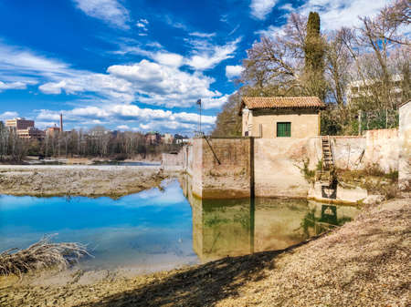 Casalecchio Dam on a sunny and cloudy day of springの写真素材