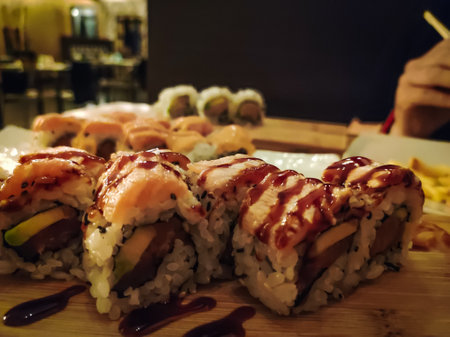 closeup on a portion of sushi in the restaurantの写真素材