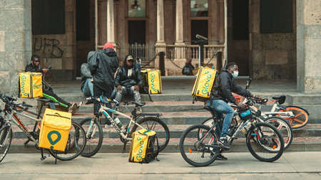 MILANO-ITALY - 26 november 2020: tired Deliveroo raiders rest after protest for the working conditions in Milanのeditorial素材