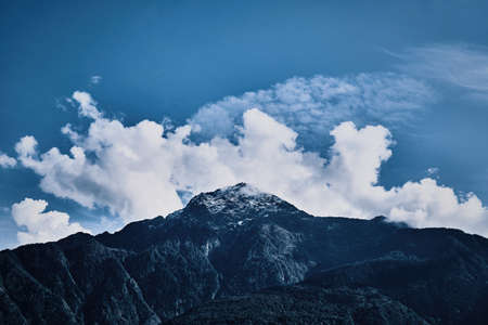 Orobie Alps peaks with white clouds on top. Near Como Lakeの写真素材