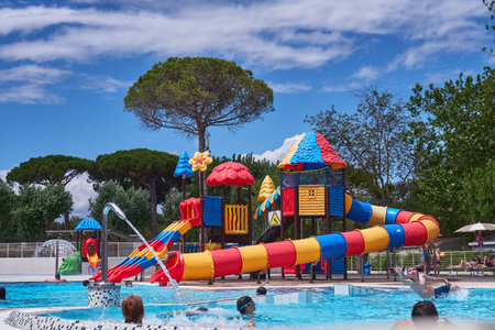 LIDO ADRIANO - RAVENNA - ITALY 13 JULY 2021:Outdoor aquatic playground with cascading water bucket.のeditorial素材