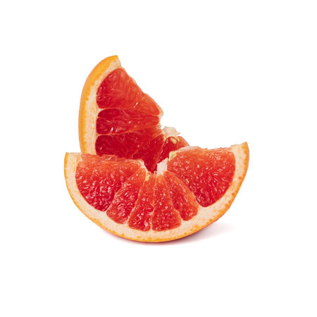 Pink ripe grapefruit slice on white isolated backgroundの写真素材