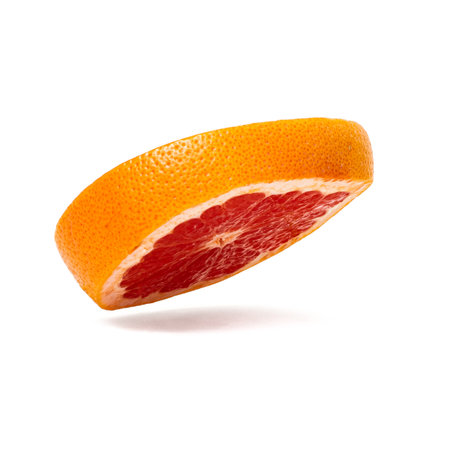 Pink ripe grapefruit slice on white isolated backgroundの写真素材