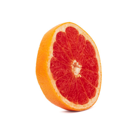 Pink ripe grapefruit slice on white isolated backgroundの写真素材