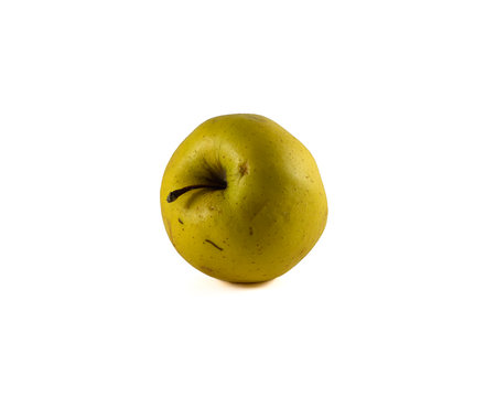 Image of a ripe yellow apple on a white backgroundの写真素材