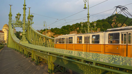Liberty Bridge in Budapest across the Danube River. Historic tram on the bridgeの写真素材