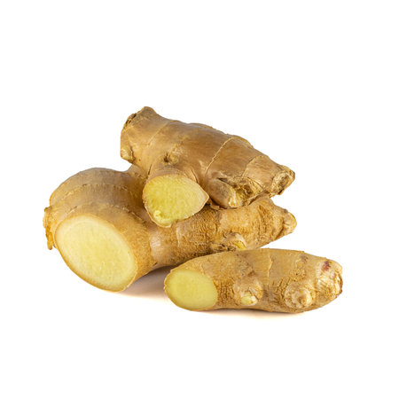 Fresh ginger rhizome with sliced isolated on white background.の写真素材
