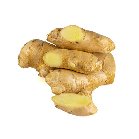 Fresh ginger rhizome with sliced isolated on white background.の写真素材