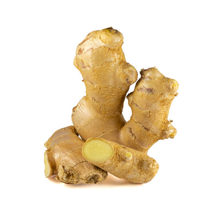 Fresh ginger rhizome with sliced isolated on white background.の写真素材