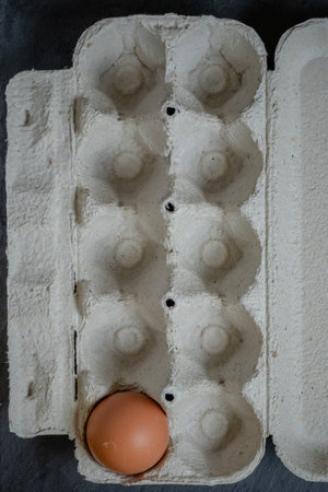 Fresh chicken eggs in a paper tray on the table, selective focusの写真素材