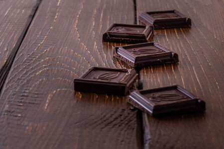 Chocolate bar pieces. Background with chocolate. Sweet food photo concept.の写真素材