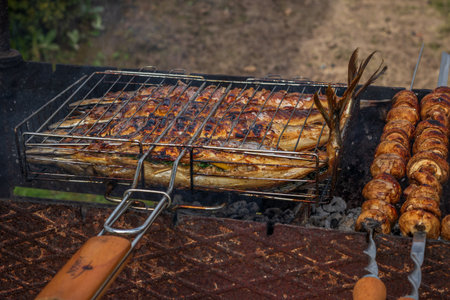 Grilled fish. Cooking fish on the barbecue grid.