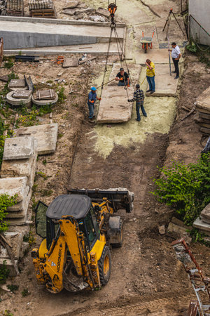 The tractor brought sand in buckets for filling Lviv Ukraine 20.05.24