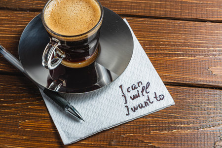 Hand written note on a coffee stained napkin with an empoweの写真素材