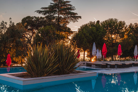 Porec Croatia 05.07.24 A beautiful swimming pool on the background of the sunsetのeditorial素材