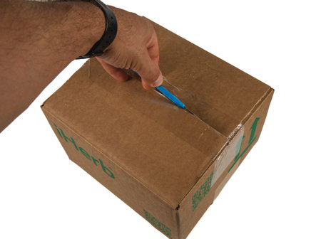 Lviv Ukraine 08.17.24 a man unpacks a box of iHerb with his left handのeditorial素材