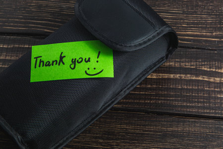 Soft box with thank you note on dark wood