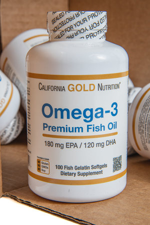 Lviv Ukraine 08.17.24 omega vitamins stand next to a box placed on its sideのeditorial素材