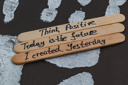 positive thoughts to increase self esteem on the background of a handprintの写真素材