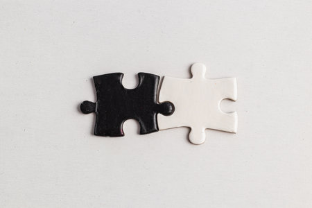A puzzle piece with and black, sense of incompleteness and mystery