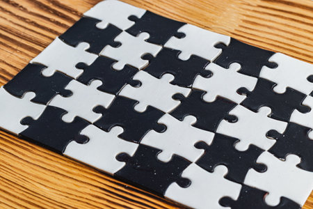 Black and white puzzle, teamwork challenge conceptの写真素材