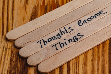 Positive thoughts for increasing selfesteem on wooden posts on wooden backgroundの写真素材