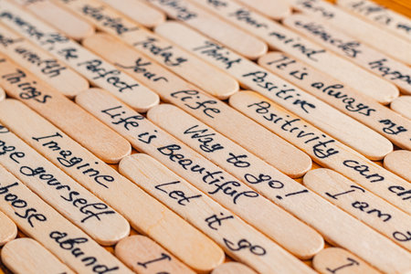 Positive thoughts for increasing selfesteem on wooden posts on wooden backgroundの写真素材