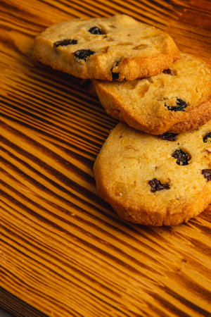Festive homemade cookies with raisins on a wooden table Christmas concertの写真素材