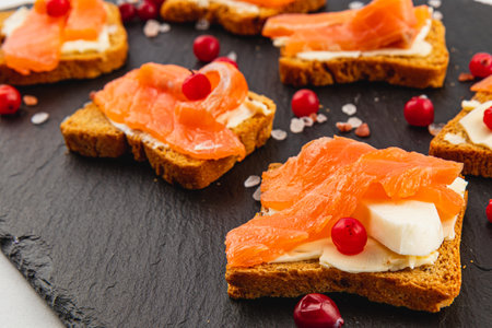 Toasts with butter and salmon for a delicious healthy breakfastの写真素材