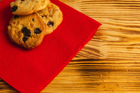 Delicious cookies with raisins on a red napkin, Christmas concept