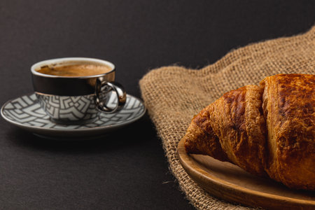 buttery croissants and rich espresso, a delightful pairing perfect for breakfast High quality photo.の写真素材
