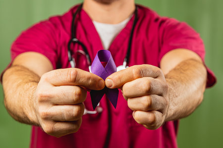 A healthcare professional in scrubs holds a purple ribbon, symbolizing mental health awareness. This moment emphasizes the significance of advocating for mental health initiatives.の写真素材