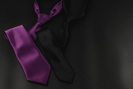 Celebrating father's day with stylish ties in purple and black colors. These gifts symbolize appreciation and love for fathers during birthdays and special occasions.の写真素材