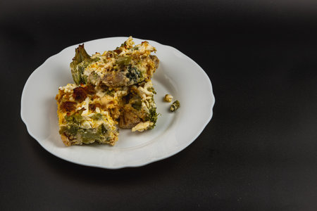 A delicious casserole features layers of vibrant broccoli and creamy sour cream, all infused with garlic. Enjoy this hearty dish for any meal.の写真素材