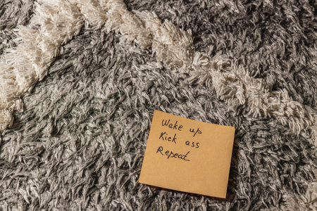 A handwritten note is placed on a plush rug, creating a warm and inviting atmosphere.の写真素材