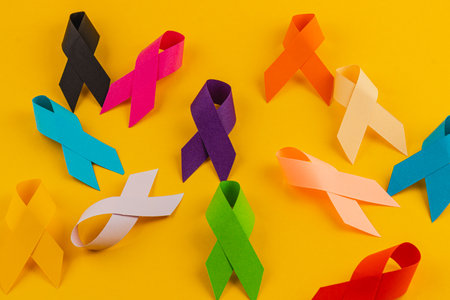 Various awareness ribbons display vibrant colors symbolizing the fight against different diseases. This display emphasizes the importance of health campaigns and community support.の写真素材