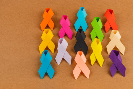 A collection of colorful awareness ribbons representing various health campaigns, including breast cancer, prostate cancer, diabetes, and overall health awareness.の写真素材