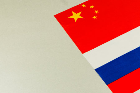 Flags of China and Russia are displayed, symbolizing the intricate web of politics, trade negotiations, and global power dynamics affecting the USA and beyond.の写真素材