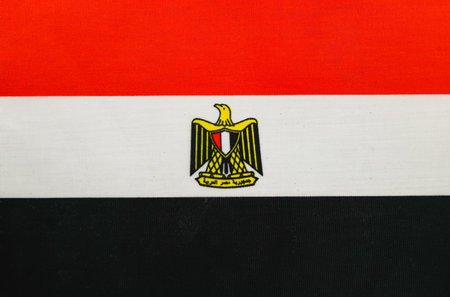 The vibrant colors of the Egyptian flag are showcased, featuring black, white, and red stripes, with the national emblem at the center.の写真素材