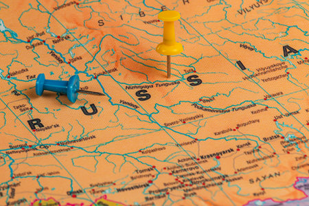 Two colored pins mark specific locations on a detailed map of Russia, displaying geographical...
