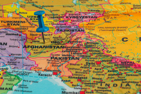 A detailed map displays Afghanistan in South Asia, marked with a blue pushpin. Surrounding countries include Pakistan, Tajikistan, and Uzbekistan, showcasing regional geography.の写真素材