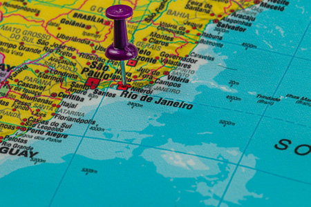 A close-up view of a map highlighting the coast of Brazil. A purple pin is placed at Rio de Janeiro and Sao Paulo, showcasing these vibrant urban areas.の写真素材