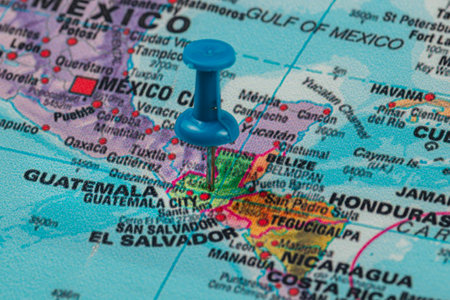 A blue pin is positioned on a detailed map, indicating the location of Guatemala City amidst the surrounding Central American countries and landmarks.の写真素材