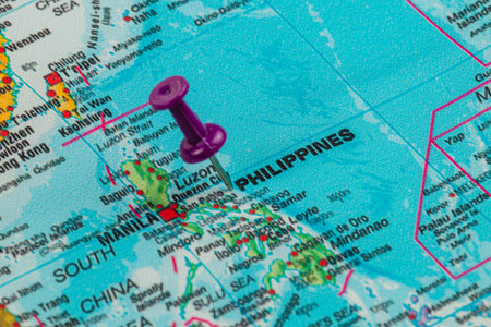 A purple pushpin marks the location of Manila on a detailed map of the Philippines, showcasing the country's geography and surrounding areas.の写真素材