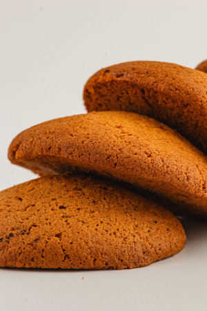A stack of warm, golden cookies showcasing a soft texture, inviting aroma, and homemade quality that makes them perfect for sharing or enjoying alone.の写真素材