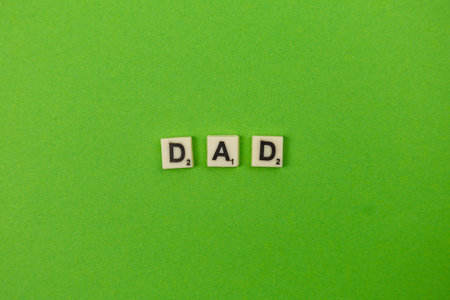 People enjoy playing a word game on a designated day. A green board displays tiles spelling the word...