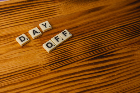 Lviv Ukraine 02.26.26 Players enjoy National Scrabble Day by forming words on wooden tiles. The...